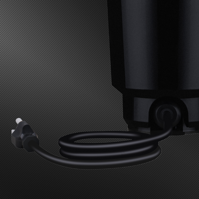 Black electrical plug and cord attached to disposal on a dark textured background