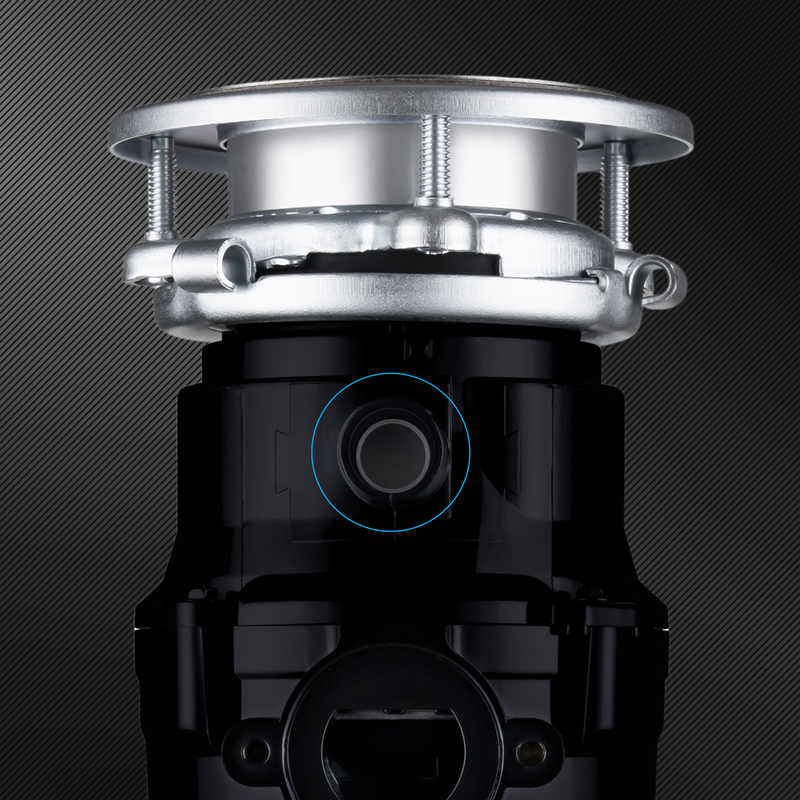 Close up of disposal dishwasher inlet on a dark textured background