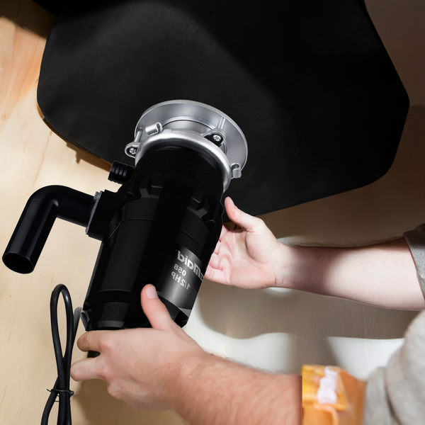 Plumber attaching disposal to under sink mount