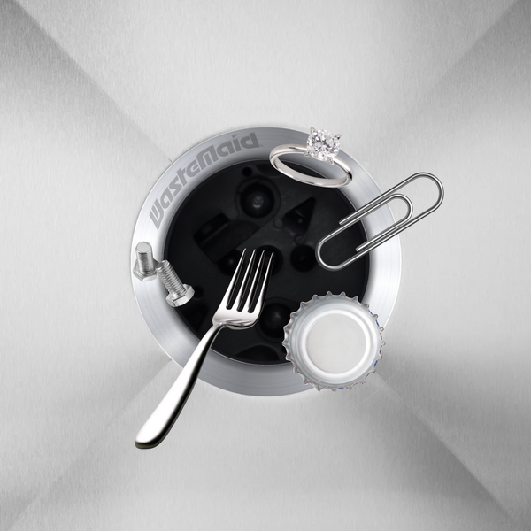 Waste maid disposal system with fork, bottle cap, and paper clip on top